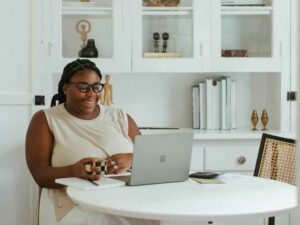 A woman working alone with her laptop on the desk